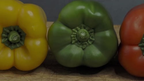 Three sweet peppers. Three colorful bell peppers red yellow and green colors in a row.