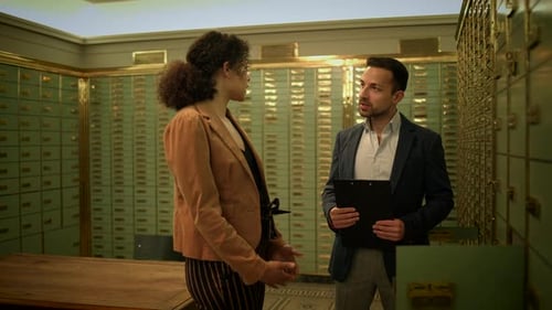 Sales Team Having a Serious Matter of Conversation Inside the Vault Room