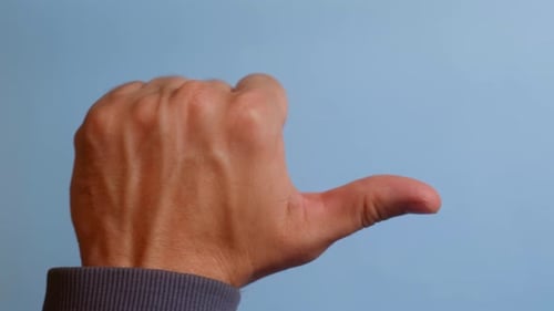 Hand Giving a Thumbs to the Left