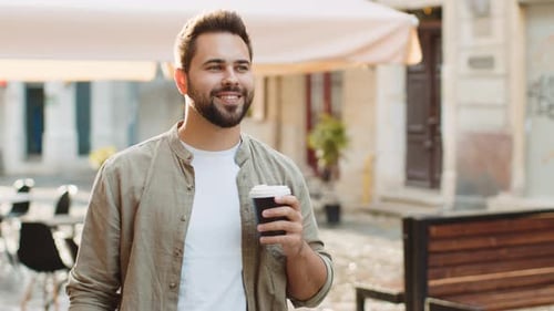 Young Man Guy Enjoying Drinking Morning Coffee Hot Drink Relaxing Taking a Break in City Street