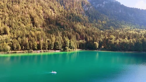 Mountain lake with turquoise water and forest.
