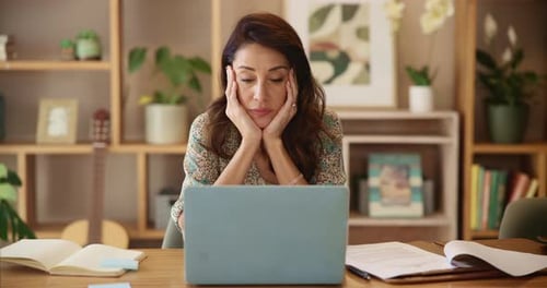 Woman at Desk Working on Laptop Computer
