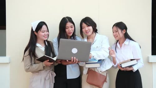 high school pupils gather in college library