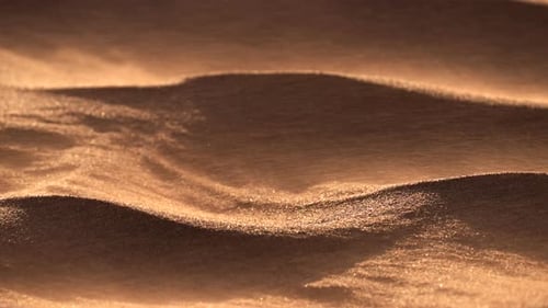 Sand Blowing Over Dunes in Wind Sandstorm in Gobi Desert Close Up
