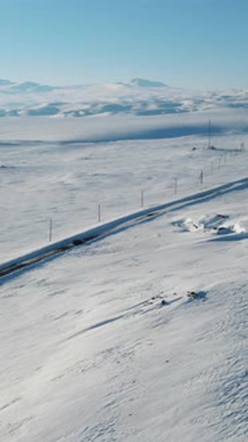 Winter Road Trip in a Snowy Landscape