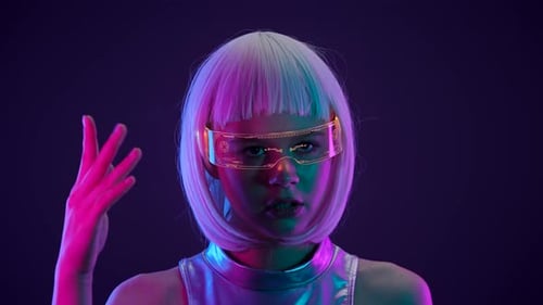 Woman Wearing Futuristic Glasses Manipulating Virtual Display