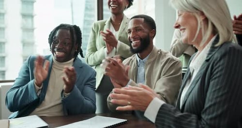 Diverse Business Team Applauding in Modern Office