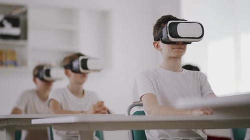 Teens Experience Virtual Reality in Classroom with Headsets