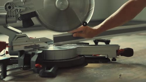 Close Up of Saw Cutting Wood in Workshop