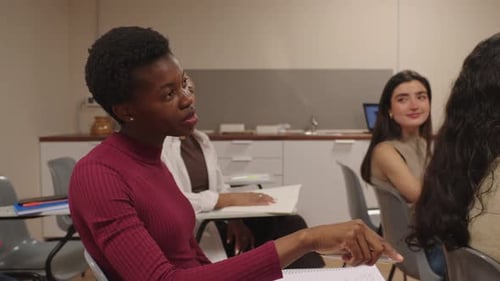 African American Student Asking Question During University Class Lecture