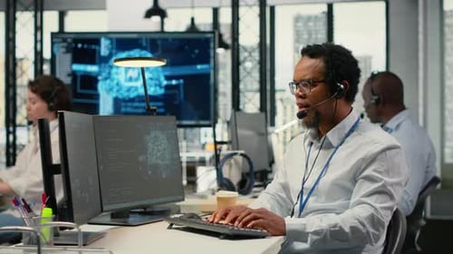 Diverse Team Members Working at Computers in an Office