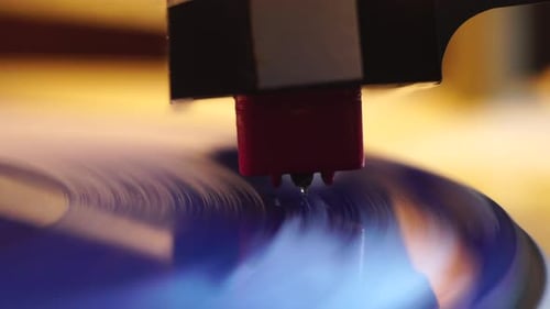 Gramophone Needle and Spinning Blue Vinyl Record, Close Up