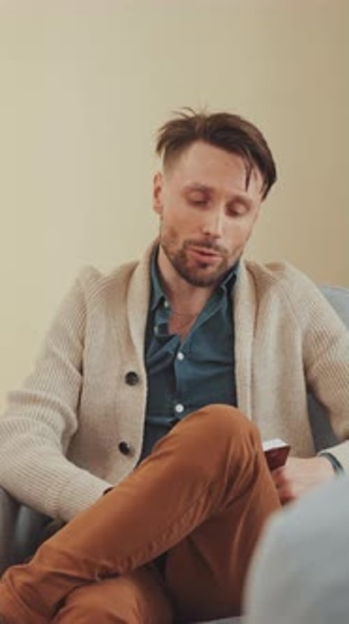 Man Talking in Counseling Session Indoors