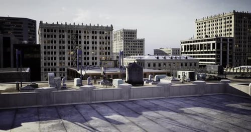 Urban Rooftop View Showcasing City Buildings and Structures at Sunset