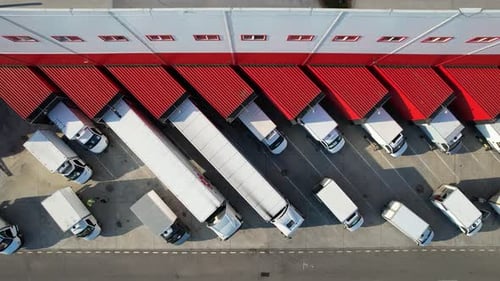 Llogistics center and vehicles waiting to be loaded or unloaded.