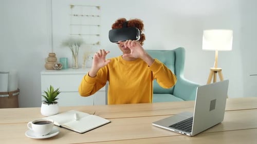 Young Adult Using VR Headset at Home