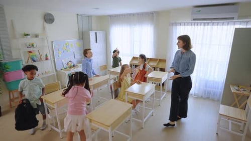 Young student leave classroom after finished study in elementary school.