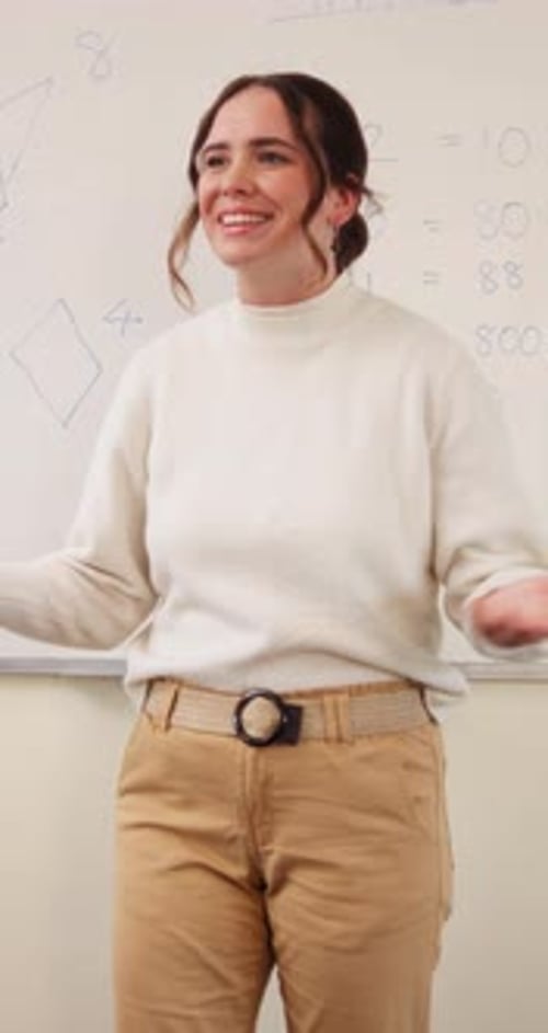 School, speaking and woman in classroom with math lesson, education and knowledge