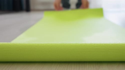Leg Steps Onto Bright Green Fitness Mat During Indoor Exercise Start