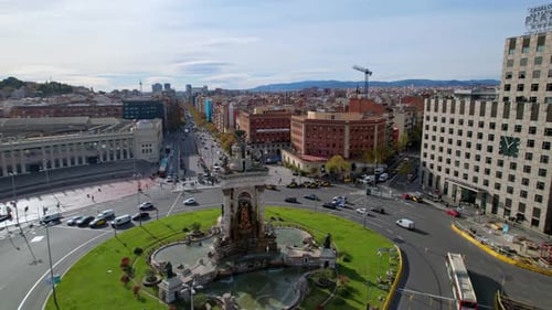 Aerial view of busy street traffic at roundabout at Plaza de Espana of Squares is one of Barcelona