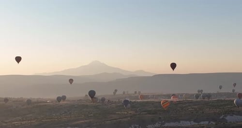 Aerial View of Natural Rock Formations in the Sunset Valley with Cave Houses in Cappadocia Turkey
