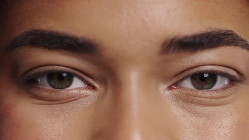 Half Face With Green Eyes Natural Eyebrows Minimal MakeUp Mixedrace Woman