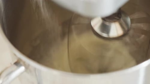 Close Up of Electric Mixer Blending Ingredients