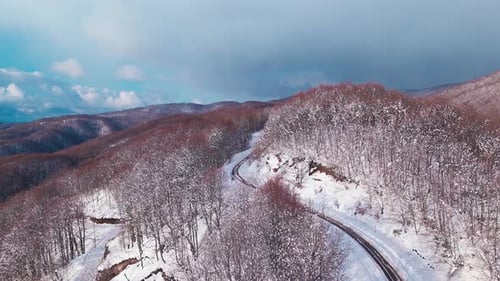 Aerial View of a Snowy Road