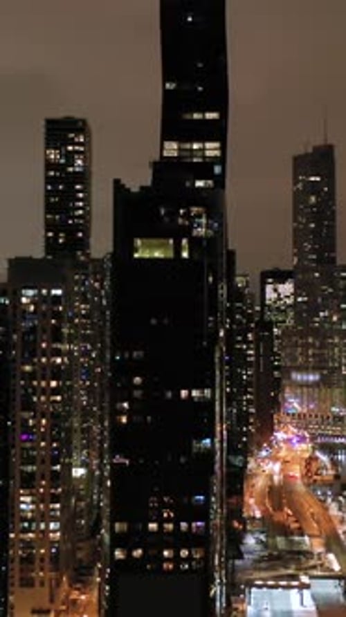Urban Skyline of Chicago and Chicago River at Night in Winter Aerial View USA Vertical Video