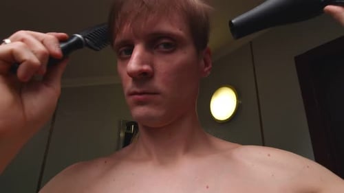 Young Adult Styling Hair with Brush and Dryer