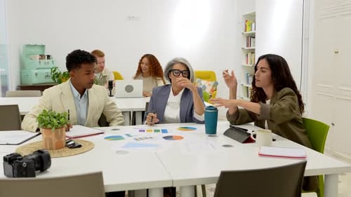 Diverse Team Collaborating on Business Strategy in Office