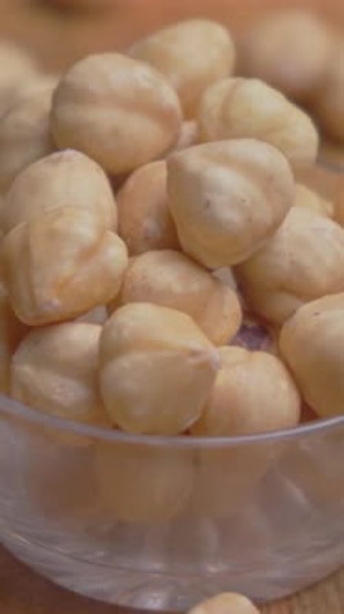 Shelled Hazelnuts Filling Up A Glass Bowl