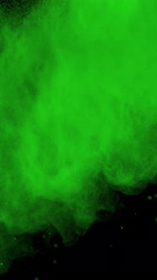 Super Slow Motion Shot of Green Color Powder Explosion at 1000Fps Vertical View