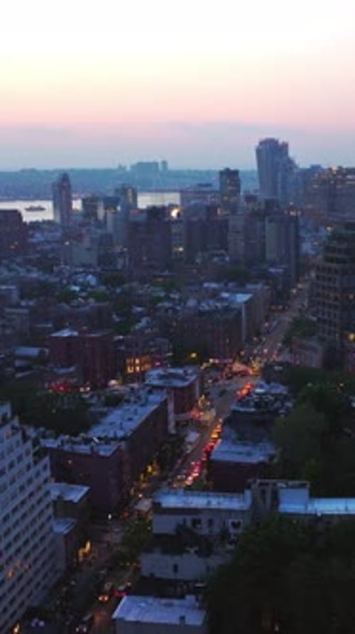 Evening falling on the gorgeous New York. Beautiful metropolis panorama with appearing lights.