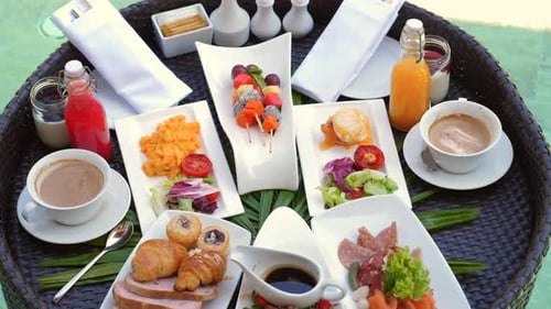 Luxurious Breakfast Spread at Tropical Resort Featuring Variety of