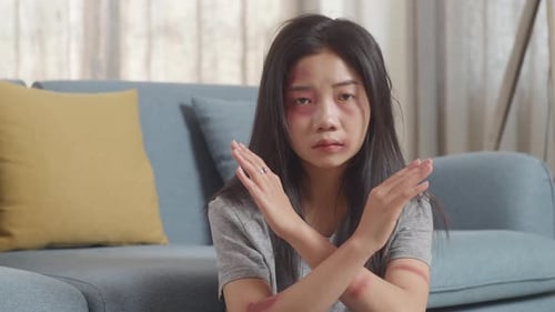 Injured Woman with Arms Crossed Expressing Rejection