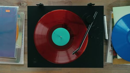 Red Vinyl Record Spinning on Turntable, Overhead View