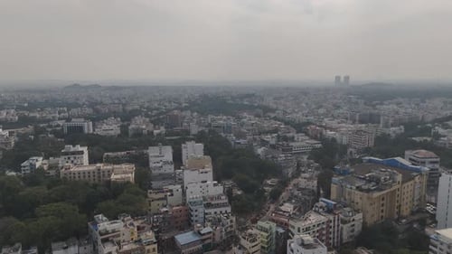 High-altitude aerial shot of Hyderabad cityscape featuring residential complexes, commercial