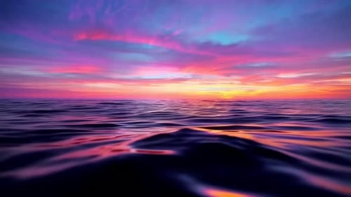 Cinematic sunset over tranquil ocean with rolling waves