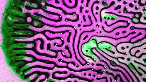 Microscopic cell structure glowing purple green
