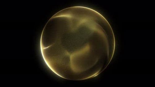 Golden yellow shimmering energy sphere of glowing liquid particles and magic plasma on dark backgrou