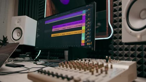 recording studio sound engineer producer mixes songs on screen colorful audio tracks professional