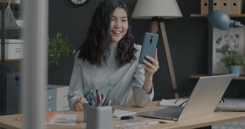Woman Enjoying Video Call at Her Home Office