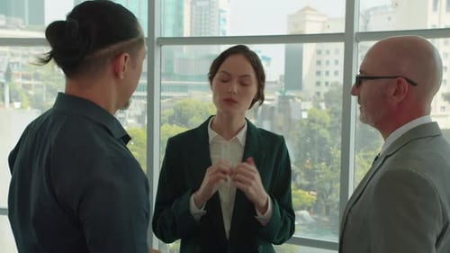 Female Manager Explaining Project Tasks to Male Employees