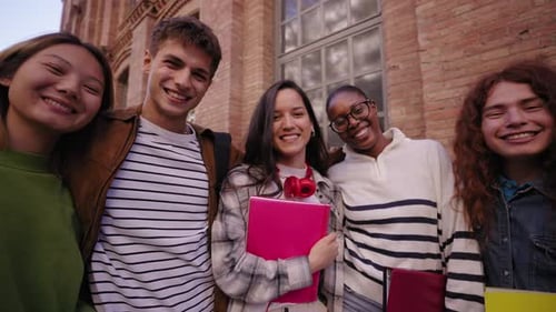 Smiling Students Standing Together Near Building