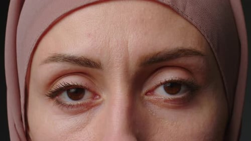 Close Up Portrait of Independent Muslim Business Woman Looking Serious Confident at Camera Wearing