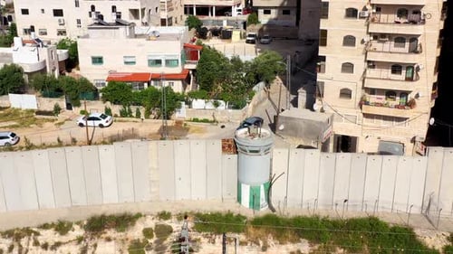 Security wall with Israeli idf watch tower Close to Shuafat Refugee Camp- Aerial