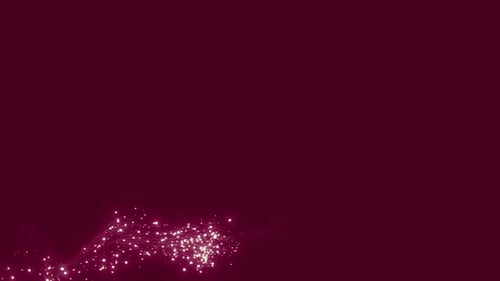 Dust particles with a luminous flare on a black background, captured in slow motion.