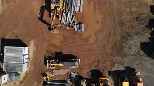 Aerial top down view of a heavy parking near highway construction site