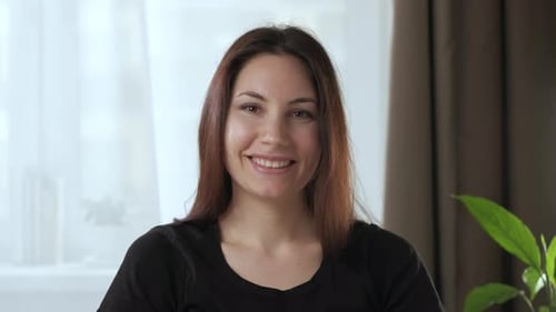 Beautiful Woman Smiling Directly at Camera